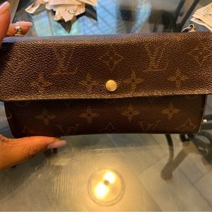 Authentic LV wallet. Noticeable wear and tear but still fully functional .